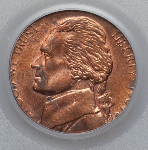 1999-P nickel struck on a cent planchet — smaller copper-colored coin with Jefferson nickel design visible